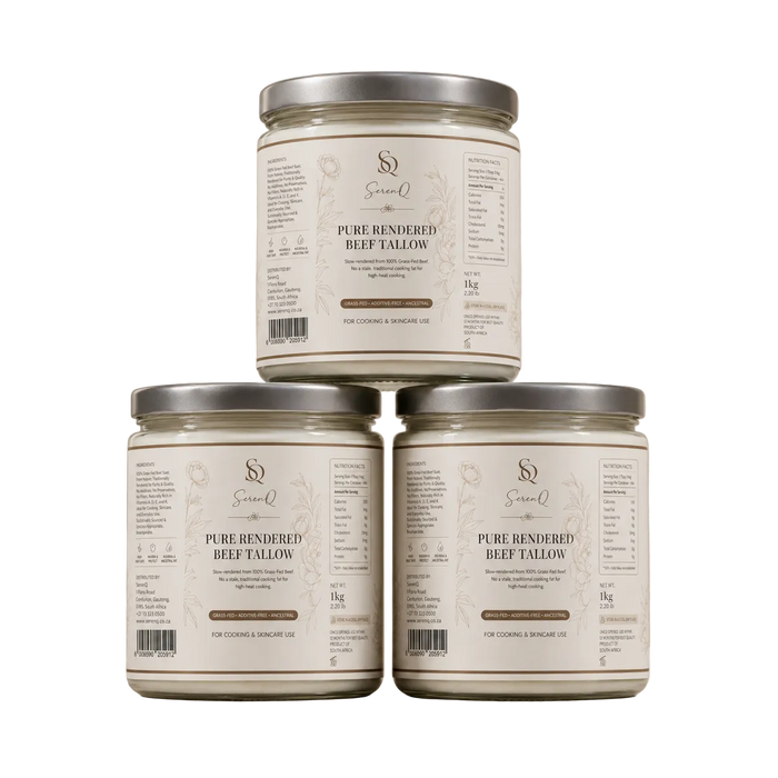 Three glass jars of Sirio-Q Pure Rendered Beef Tallow candles arranged in a pyramid stack on a beige surface with soft leaf shadows. The jars have cream-colored labels with brown text and silver metal lids.